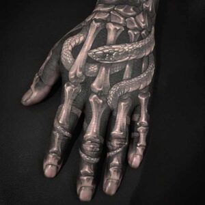Bone and Snake Hand Tattoo